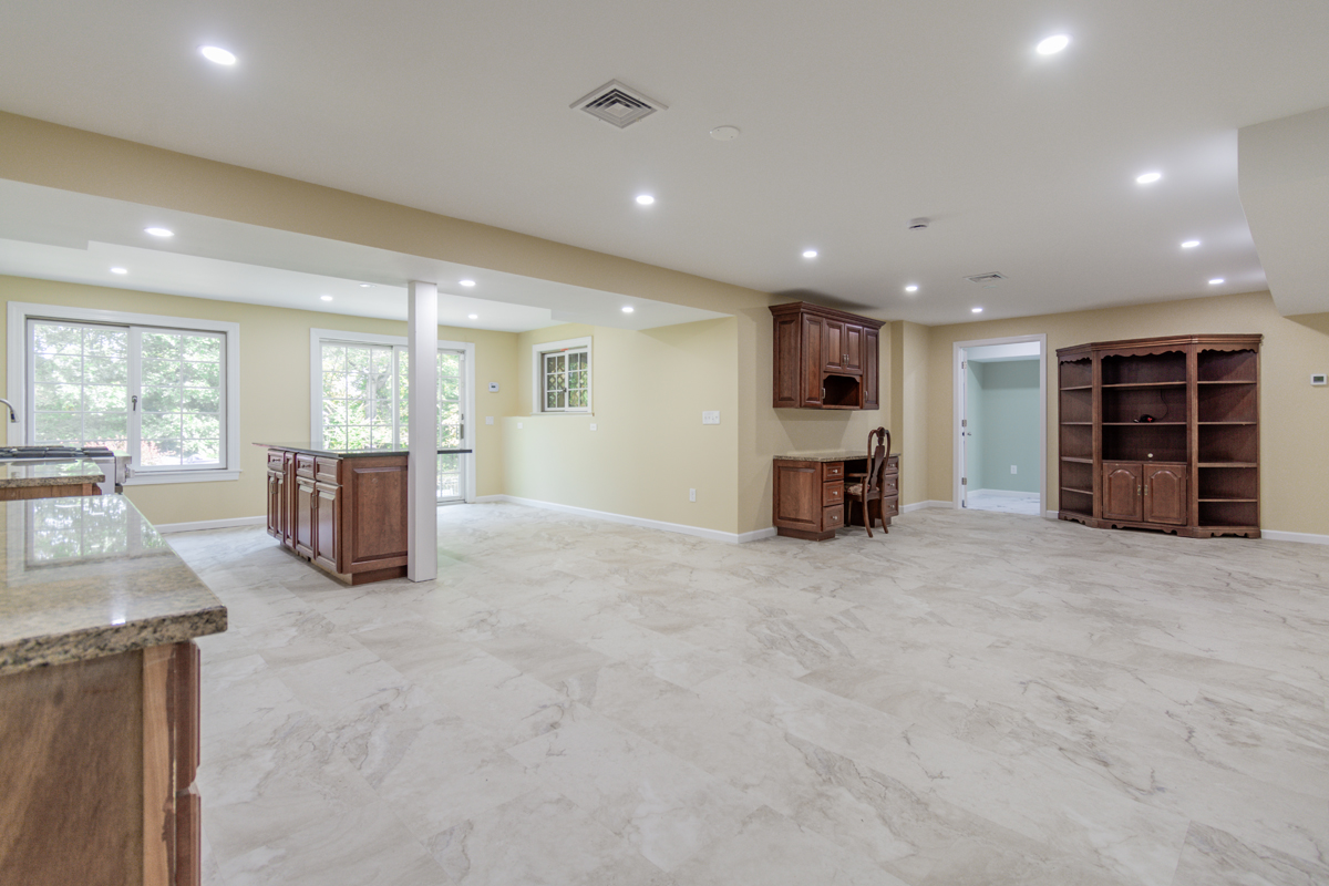 After basement remodeling at Smith Residence in Brookfield CT showing finished walls, ceiling, and trim details